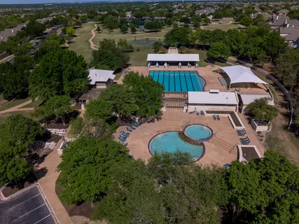 an aerial view of a house with garden space and outdoor space