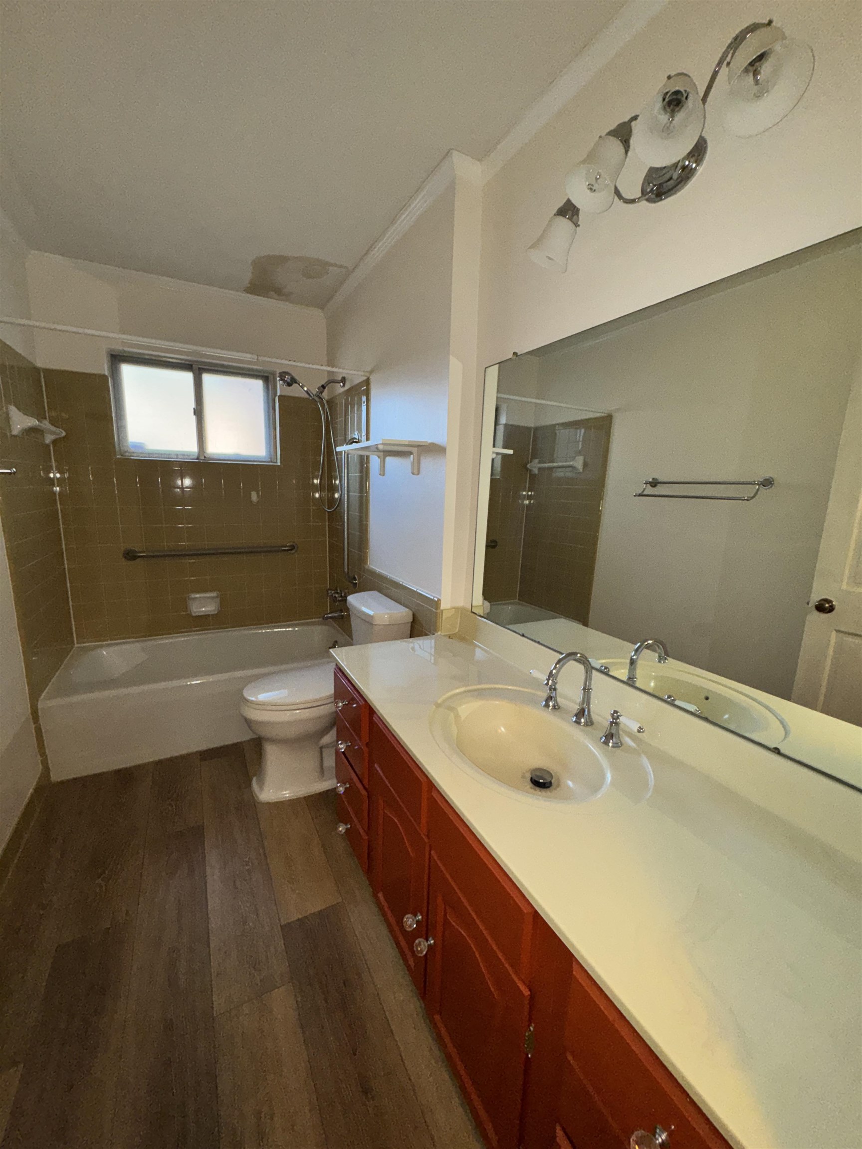 1979 Kirby Parkway Memphis, TN 38119 - Photo 14 of 28 a bathroom with a granite countertop sink a toilet and bathtub