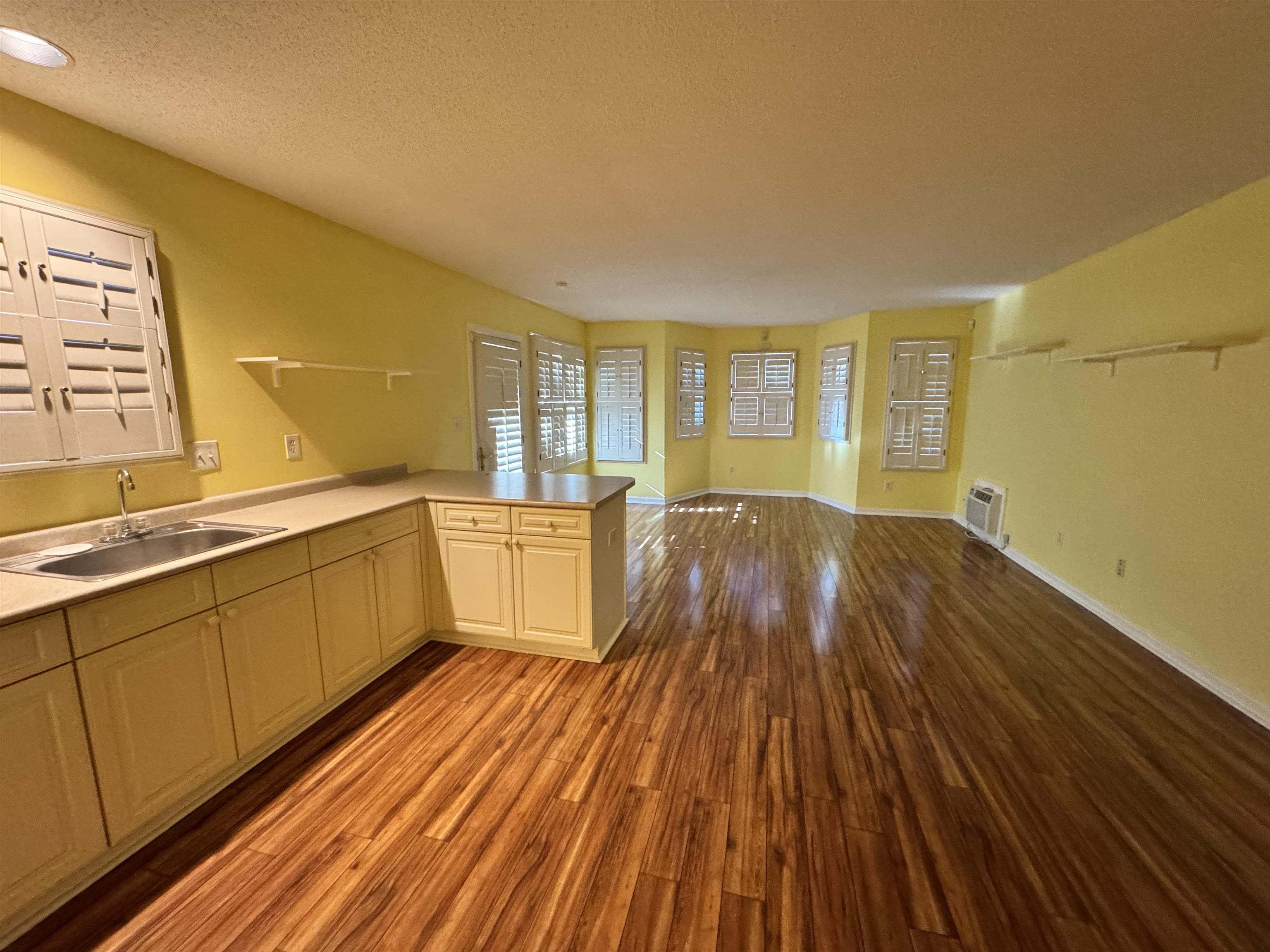 1979 Kirby Parkway Memphis, TN 38119 - Photo 28 of 28 a large room with wooden floor and furniture
