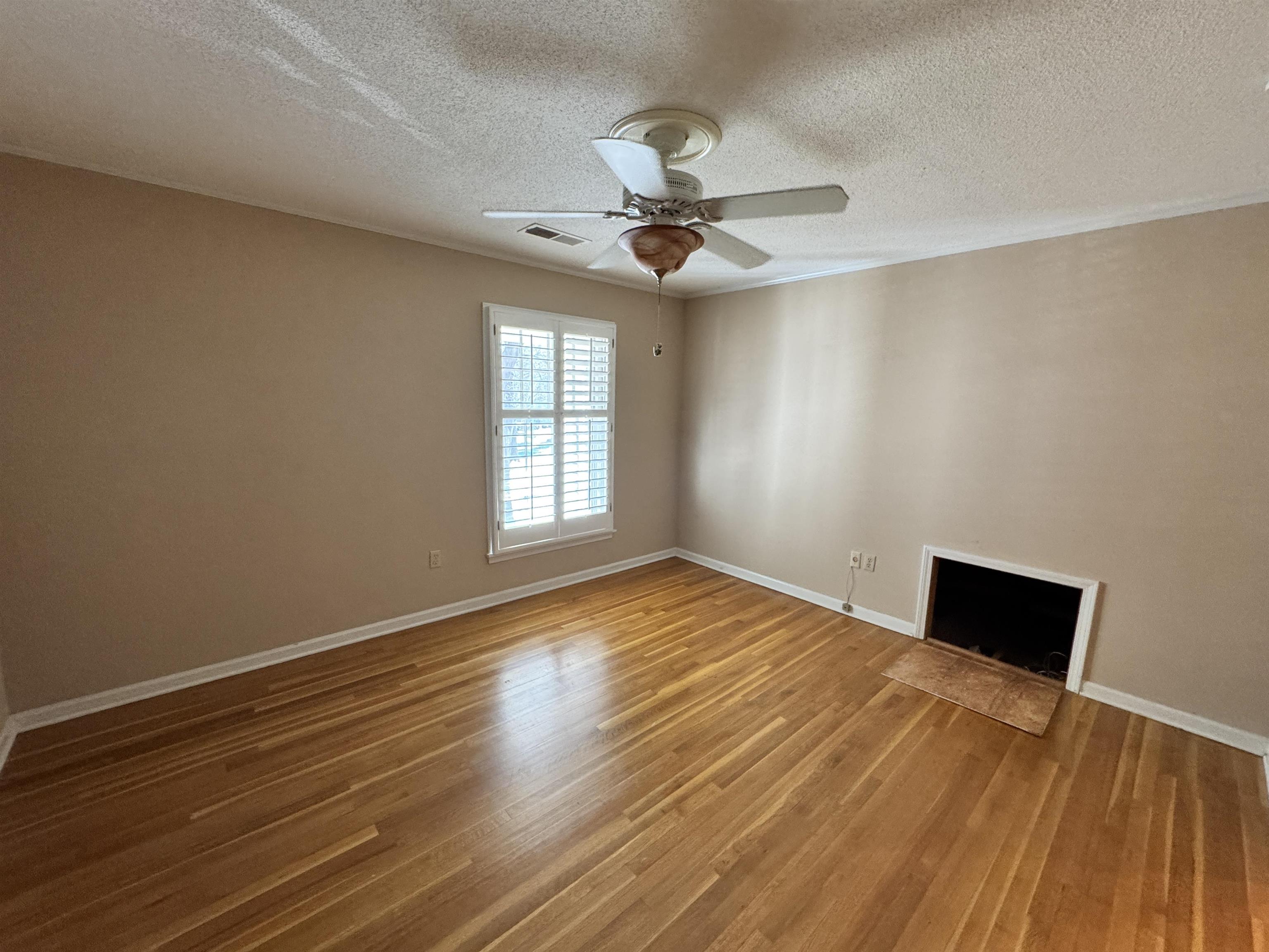 1979 Kirby Parkway Memphis, TN 38119 - Photo 18 of 28 a view of empty room with wooden floor and fan