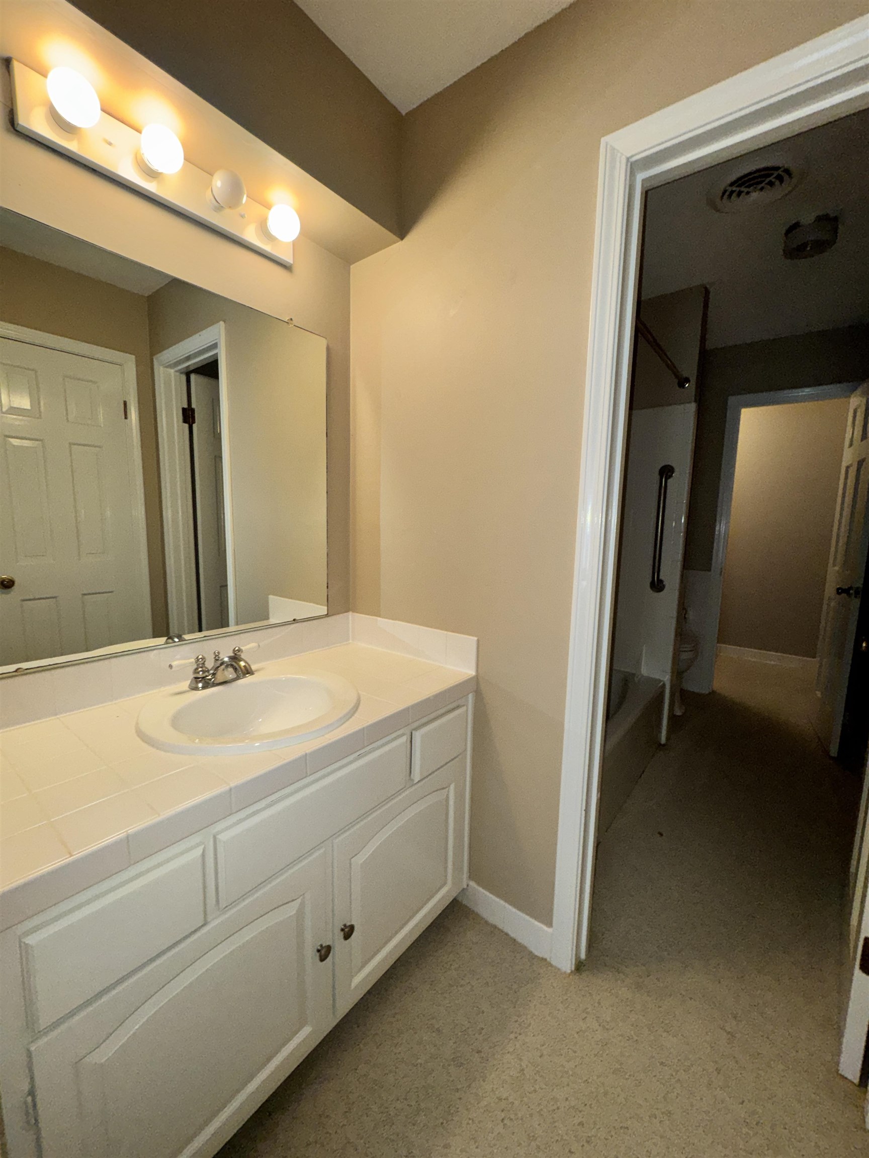 1979 Kirby Parkway Memphis, TN 38119 - Photo 19 of 28 a bathroom with a sink and a mirror