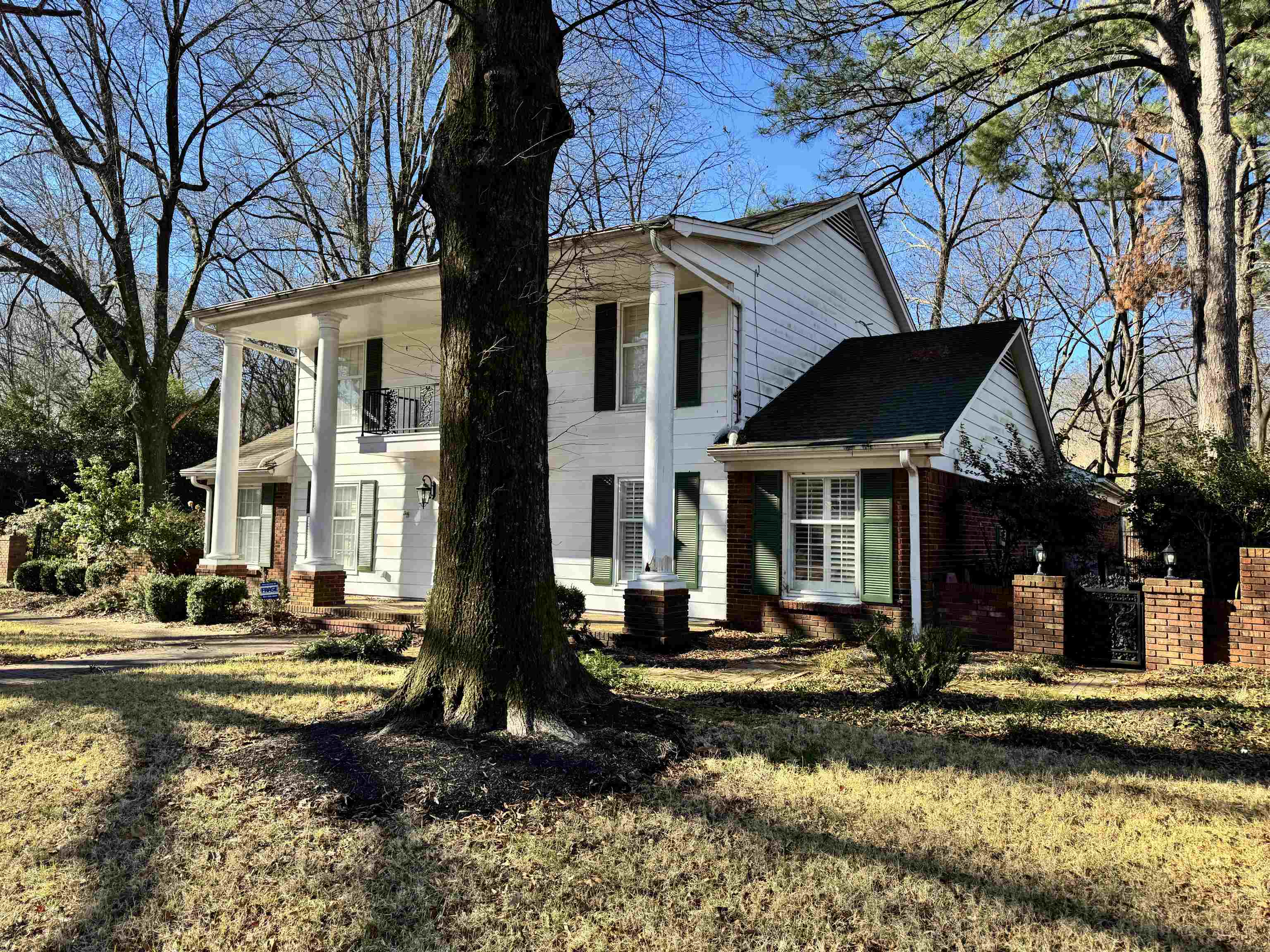 1979 Kirby Parkway Memphis, TN 38119 - Photo 2 of 28 a front view of a house with a yard fountain