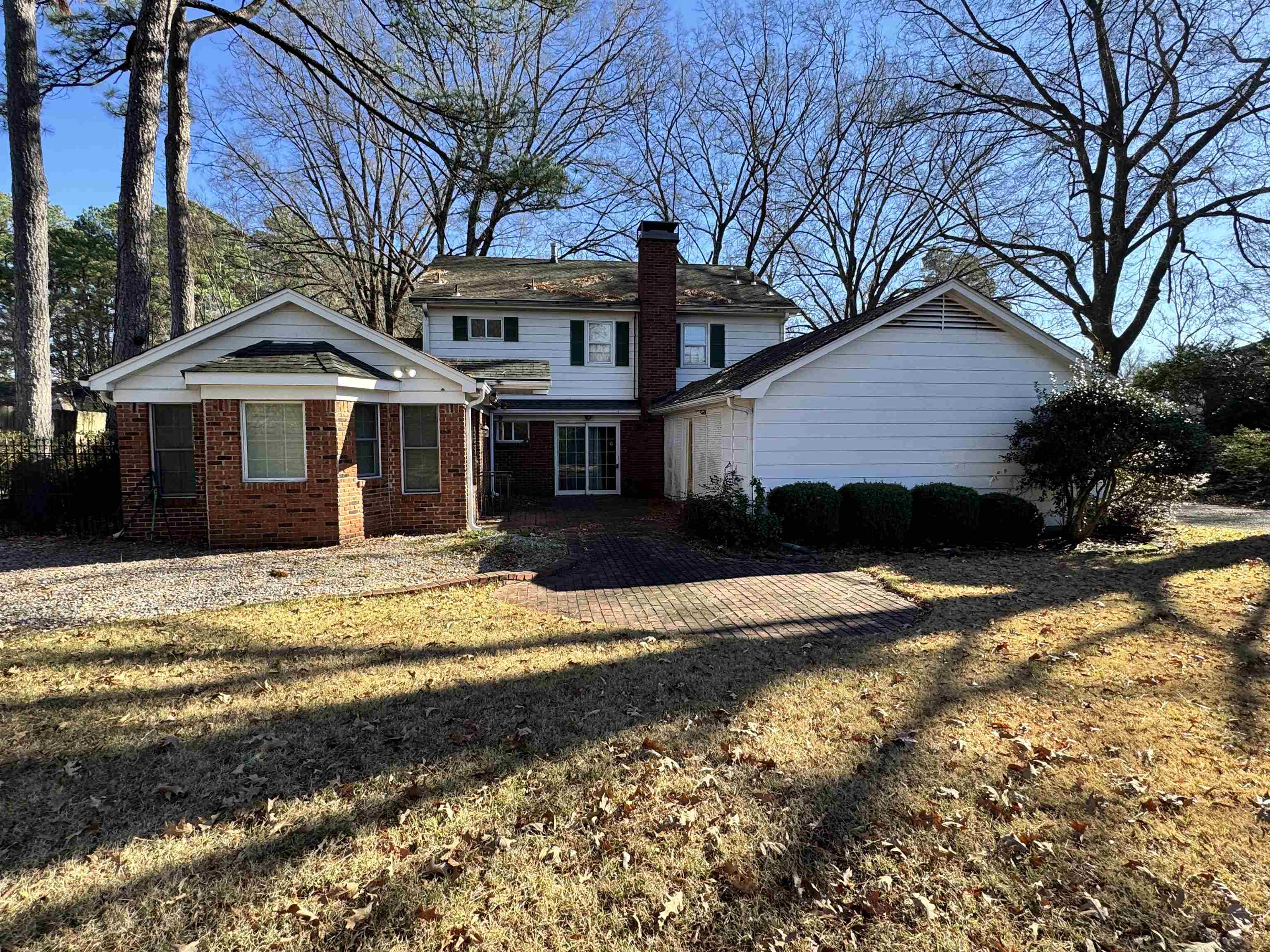 1979 Kirby Parkway Memphis, TN 38119 - Photo 25 of 28 a front view of a house with a yard covered with snow and trees