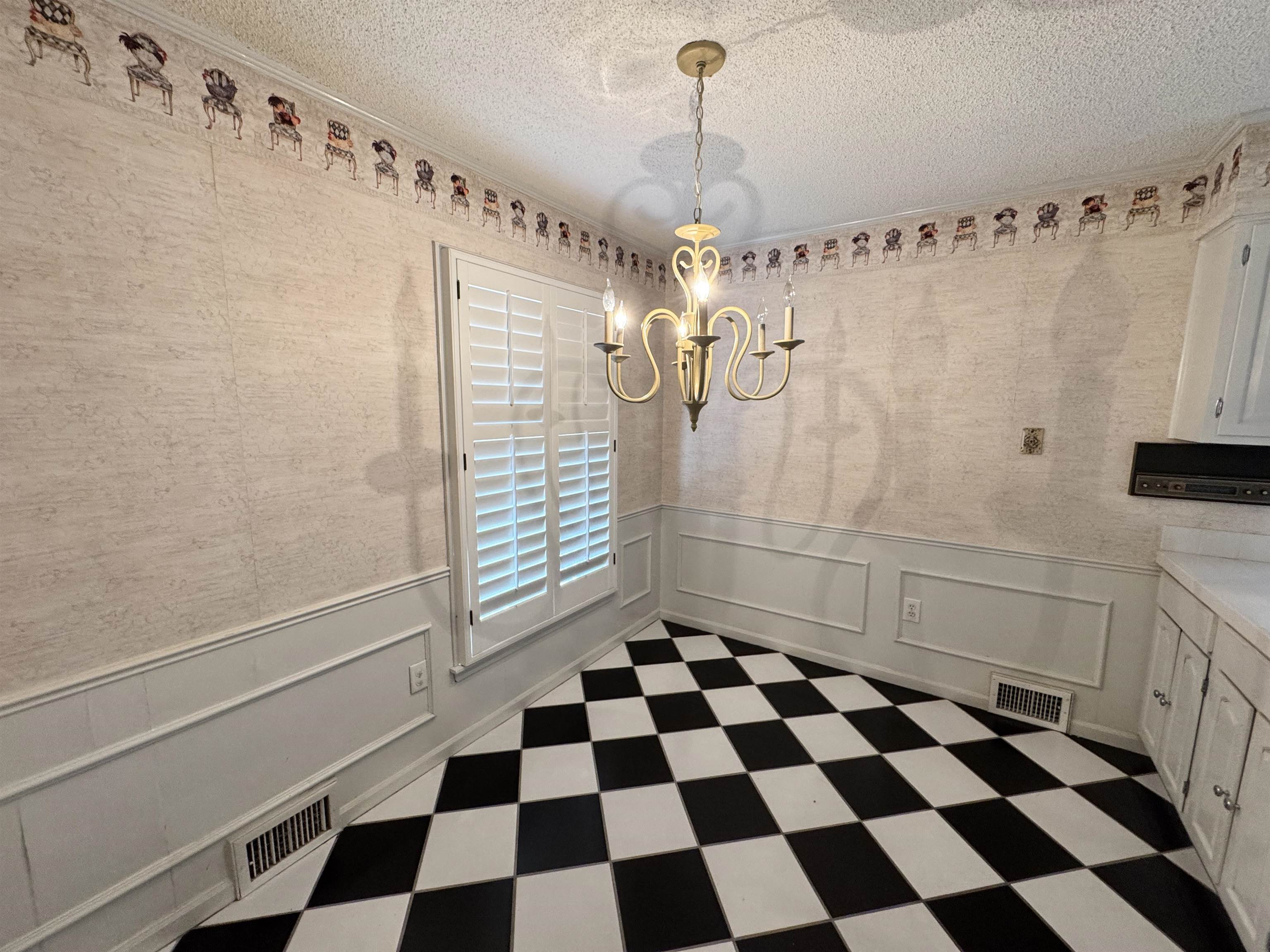 1979 Kirby Parkway Memphis, TN 38119 - Photo 10 of 28 a room with a black white checkered floor and a white checkered floor with a white kitchen