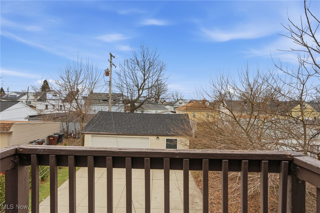 7911 Snow Road Parma, OH 44129 - Photo 23 of 44 Wooden terrace featuring a residential view and a detached garage