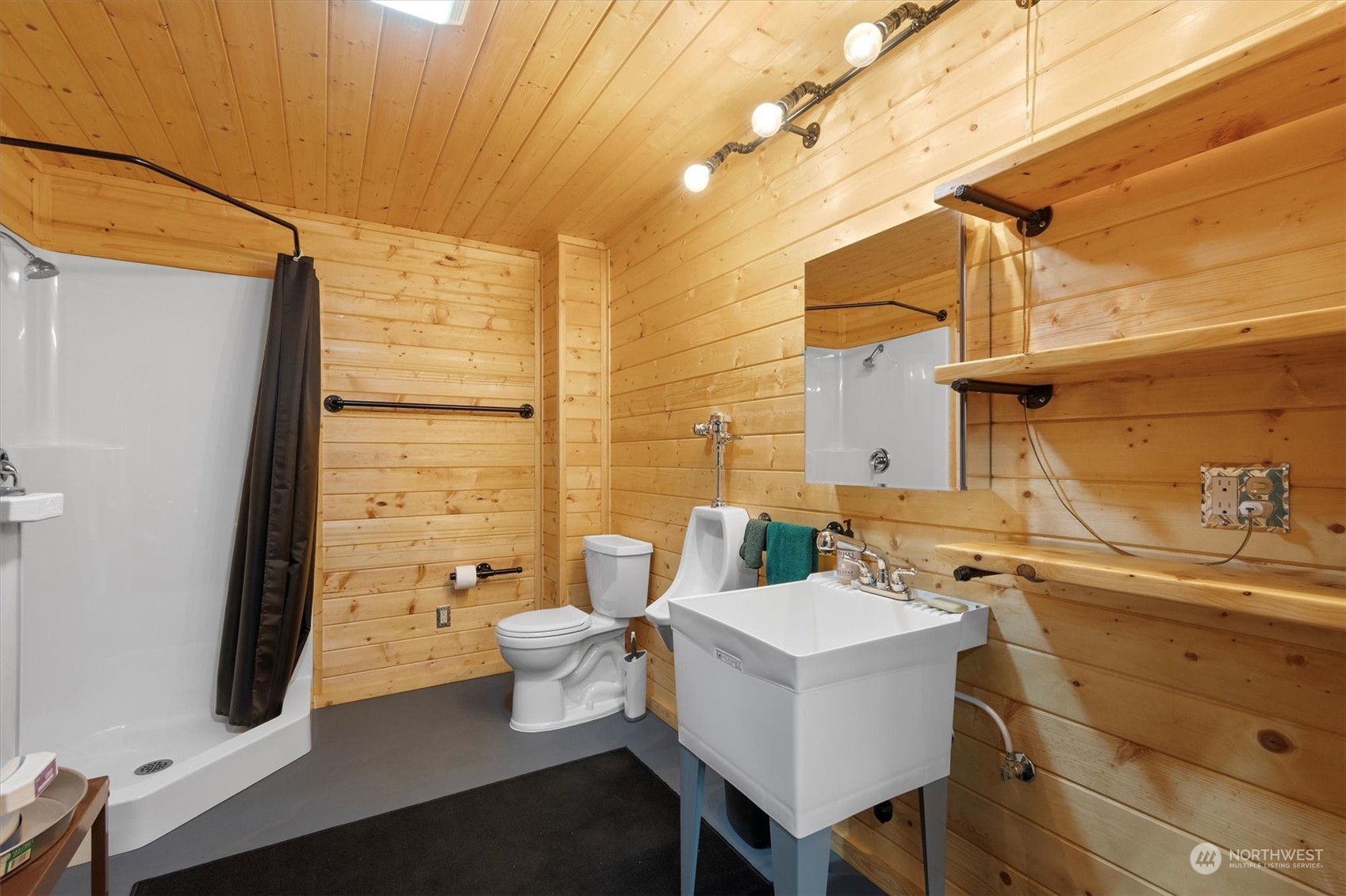 203 Don Martin Road Longview, WA 98632 - Photo 28 of 39 a bathroom with a sink mirror and a toilet