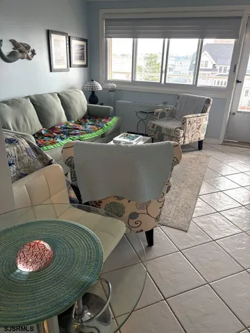 a living room with furniture and window