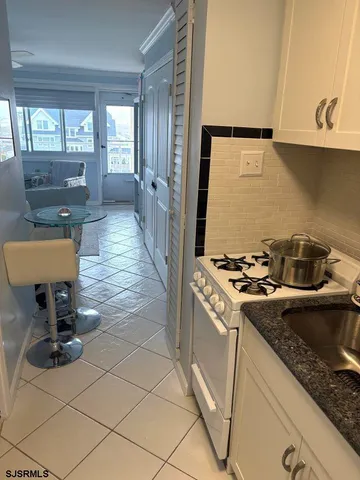 a kitchen that has a sink and a stove