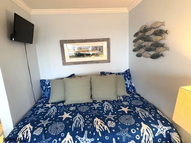 a room with a couch and a flat screen tv