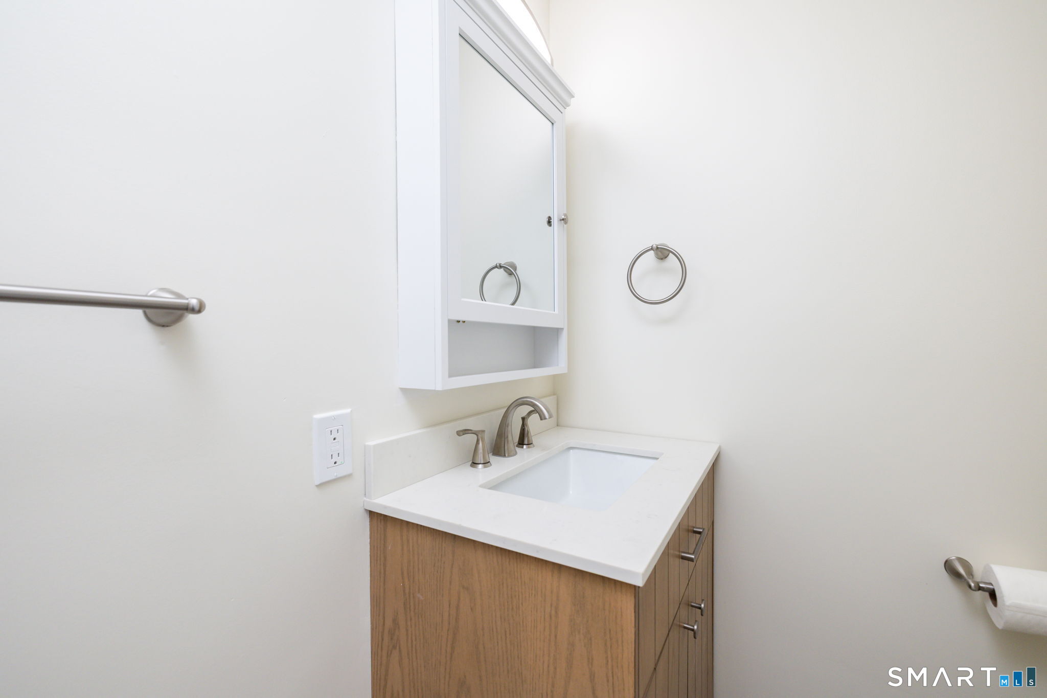 41 Walnut Street Enfield, CT 06082 - Photo 14 of 38 a bathroom with a sink and a mirror