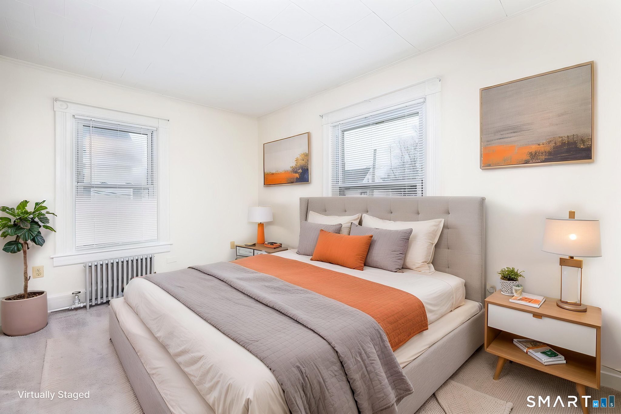 41 Walnut Street Enfield, CT 06082 - Photo 19 of 38 a bedroom with bed and a potted plant