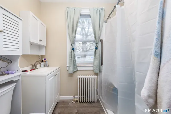 a room with a window and washer