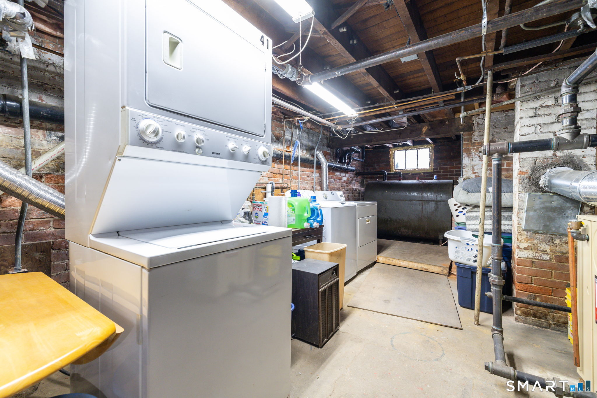 41 Walnut Street Enfield, CT 06082 - Photo 32 of 38 a storage room with washer and dryer