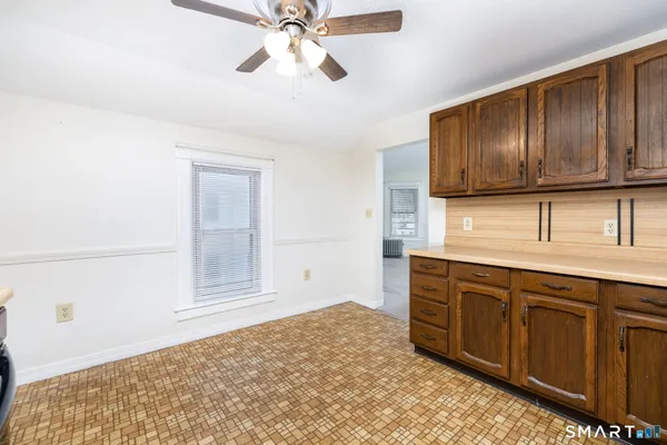 a kitchen with a sink cabinets and window