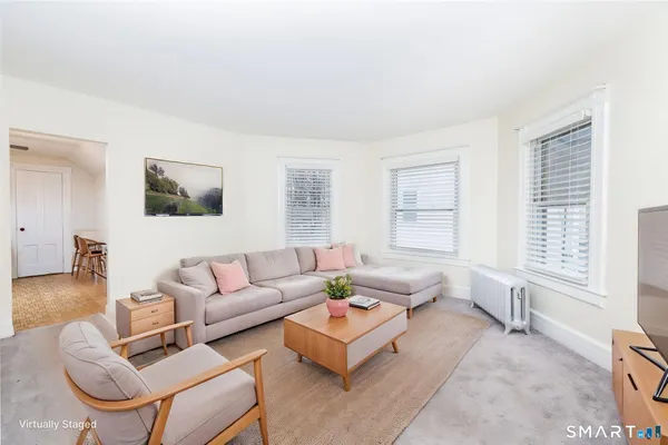 a living room with furniture and a window
