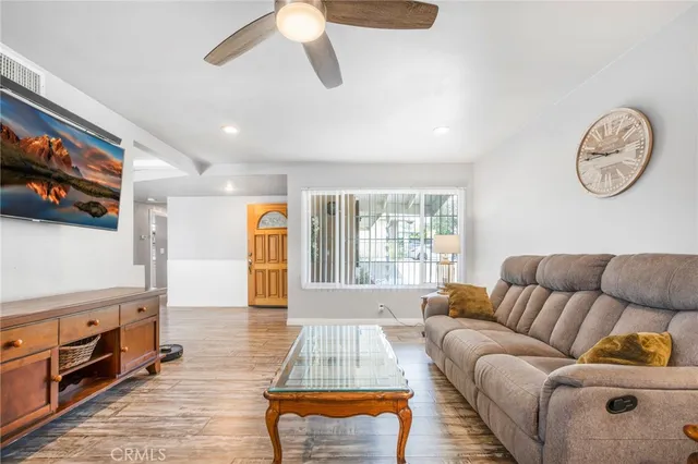 a living room with furniture and a large window