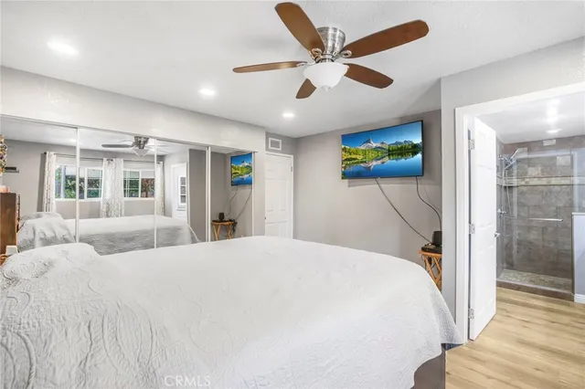 a bedroom with a large bed and a large window