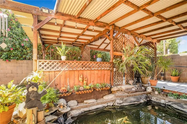 a view of swimming pool with a yard and sitting area