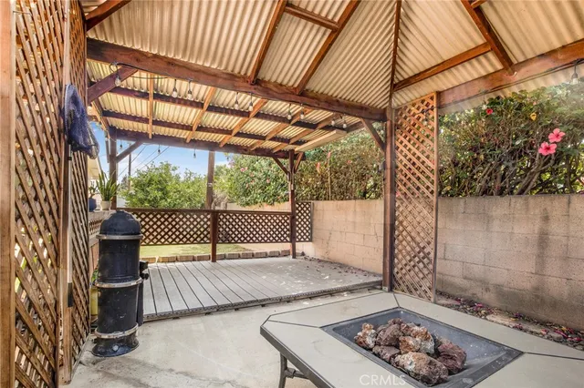 a view of a backyard with a tub and outdoor space