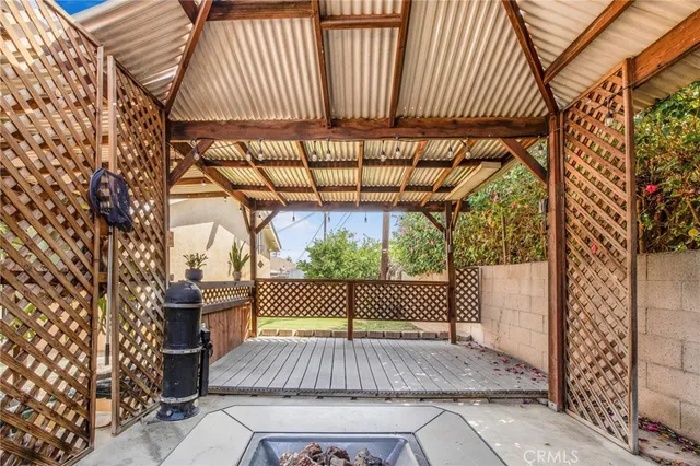 a view of outdoor space with wooden floor