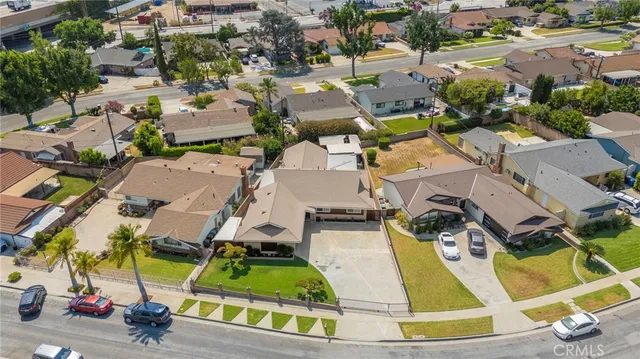 an aerial view of a house with a swimming pool