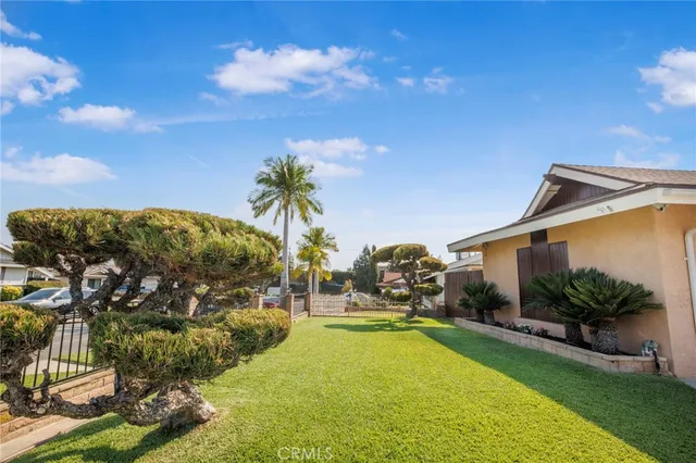 a view of swimming pool with outdoor seating and green space