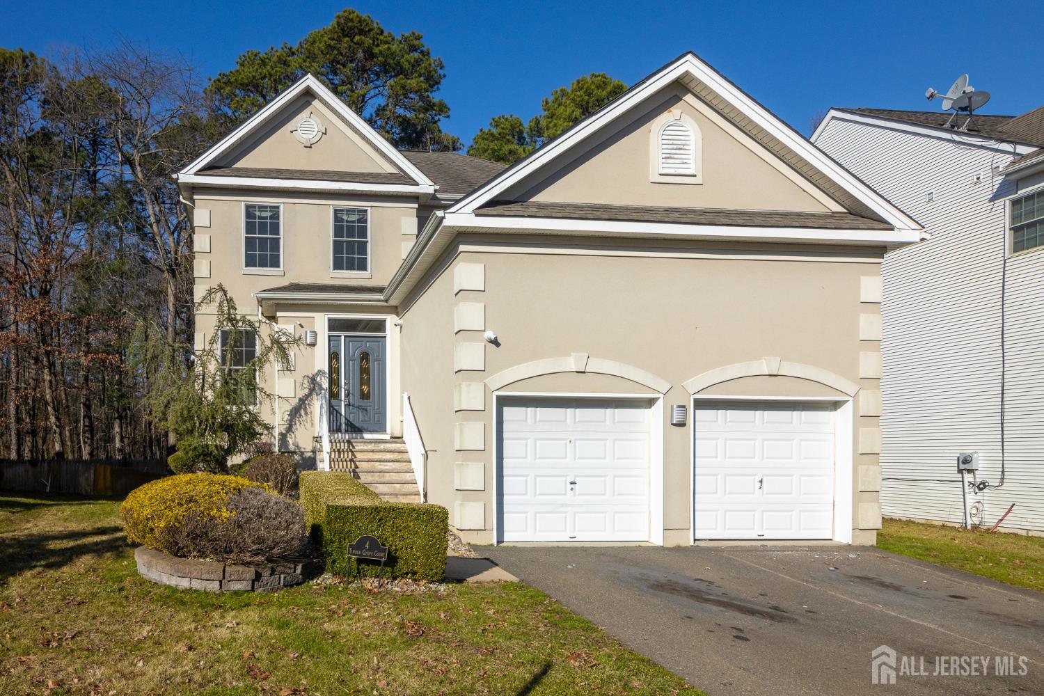 4 Timber Grove Court Old Bridge, NJ 08857 - Photo 1 of 20 a front view of a house with a yard
