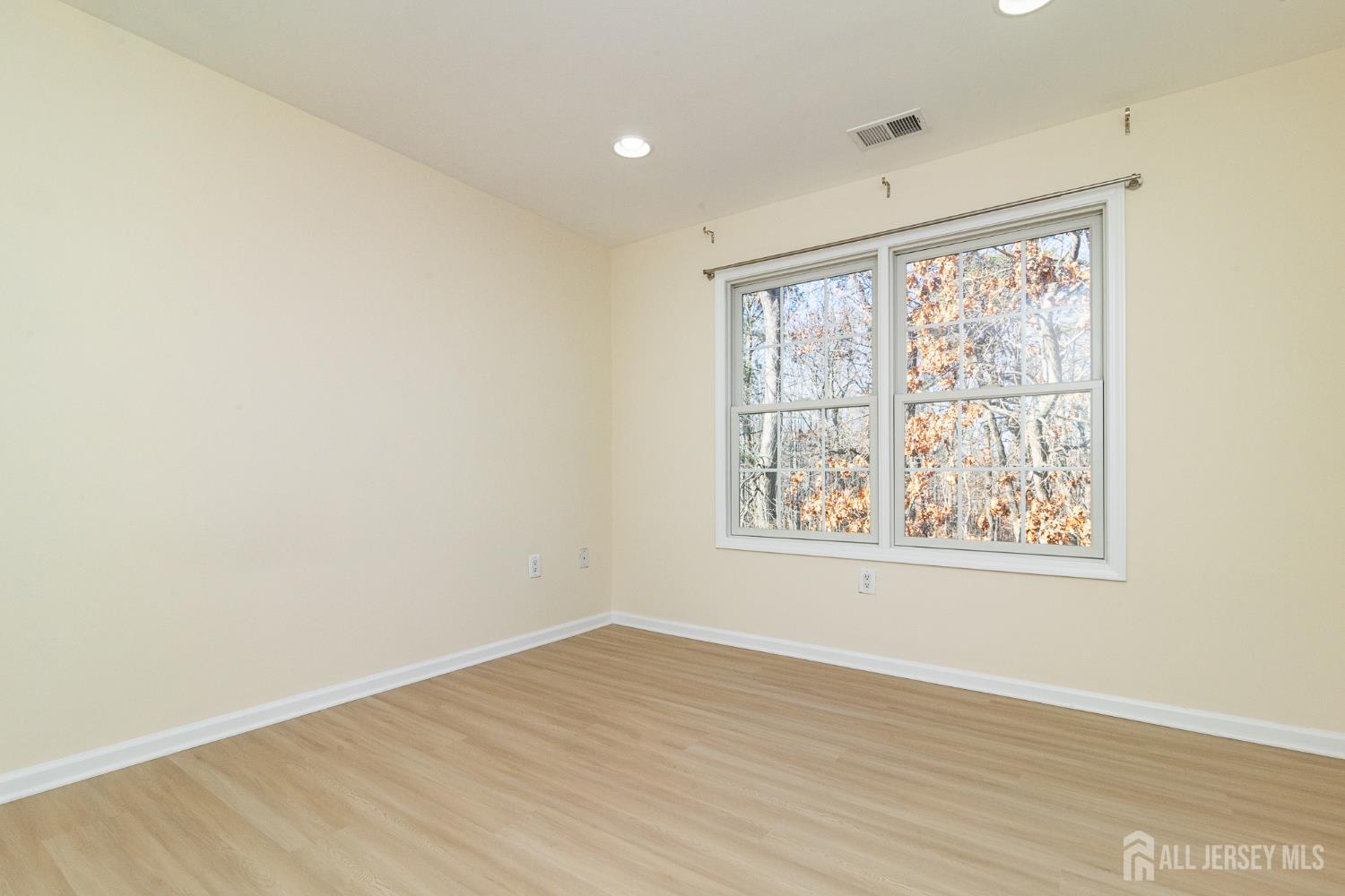 4 Timber Grove Court Old Bridge, NJ 08857 - Photo 14 of 20 an empty room with wooden floor and windows