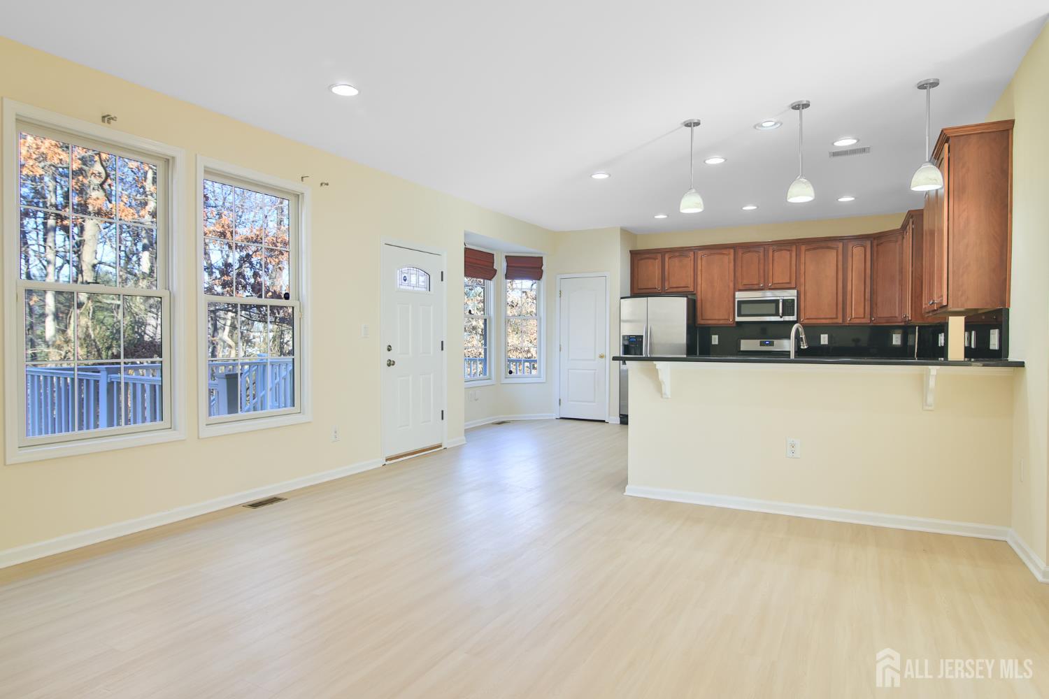 4 Timber Grove Court Old Bridge, NJ 08857 - Photo 2 of 20 a large kitchen with stainless steel appliances a large counter top and a stove top oven