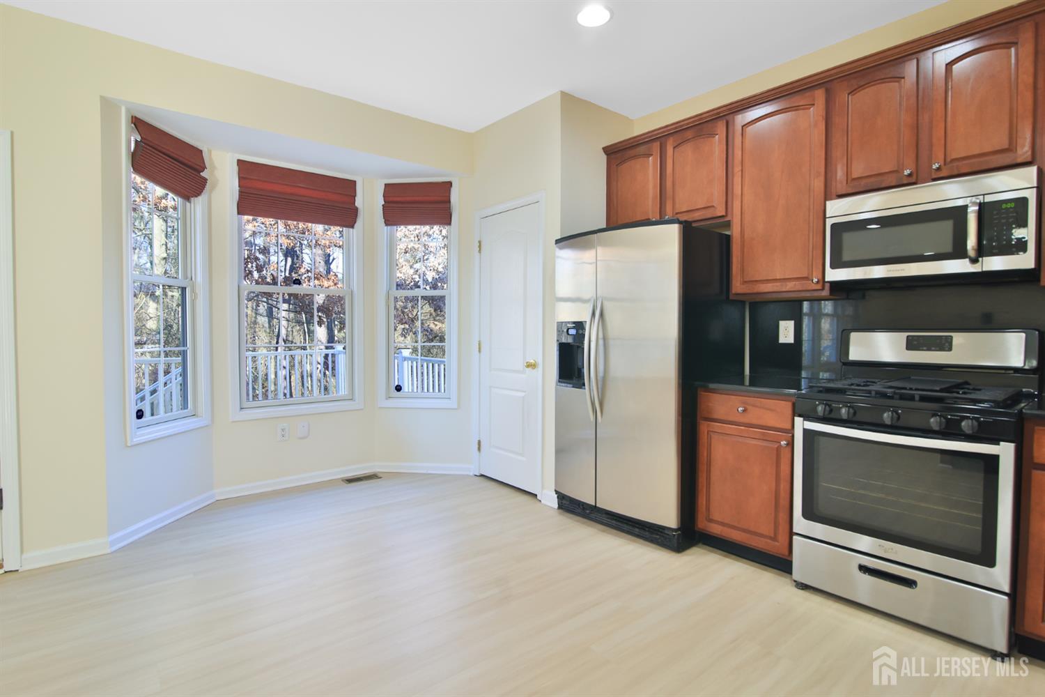 4 Timber Grove Court Old Bridge, NJ 08857 - Photo 5 of 20 a kitchen with stainless steel appliances granite countertop a refrigerator oven stove a sink and dishwasher