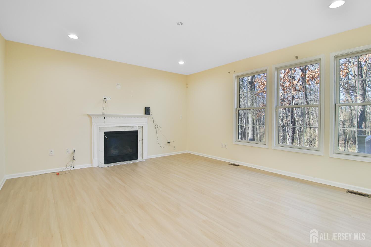 4 Timber Grove Court Old Bridge, NJ 08857 - Photo 6 of 20 a view of empty room with a fireplace