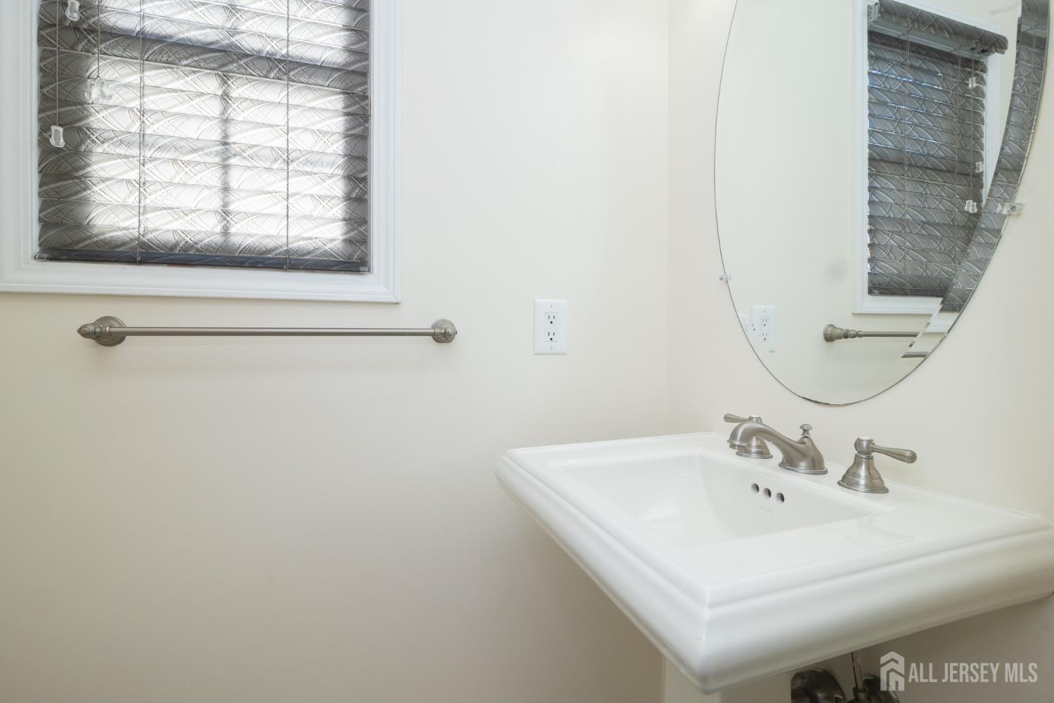 4 Timber Grove Court Old Bridge, NJ 08857 - Photo 7 of 20 a white sink sitting next to a bathroom sink