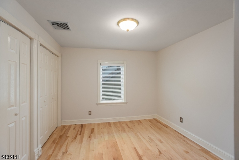 14 Locust Street Madison, NJ 07940 - Photo 27 of 33 an empty room with a hardwood and a window