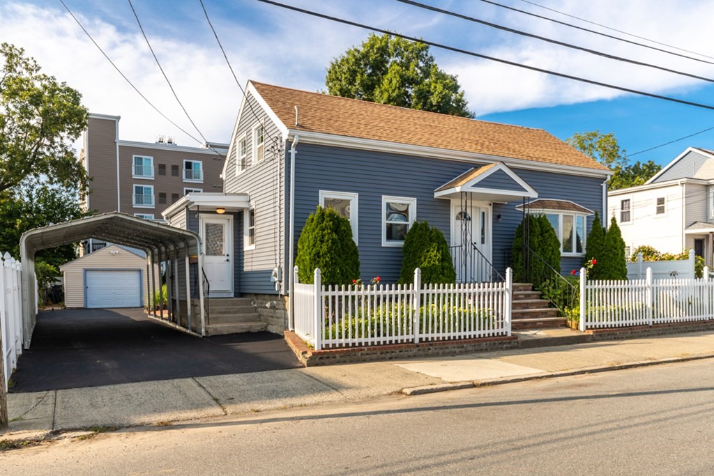 97 River Street Lynn, MA 01905 - Photo 2 of 30 a front view of a house with a porch