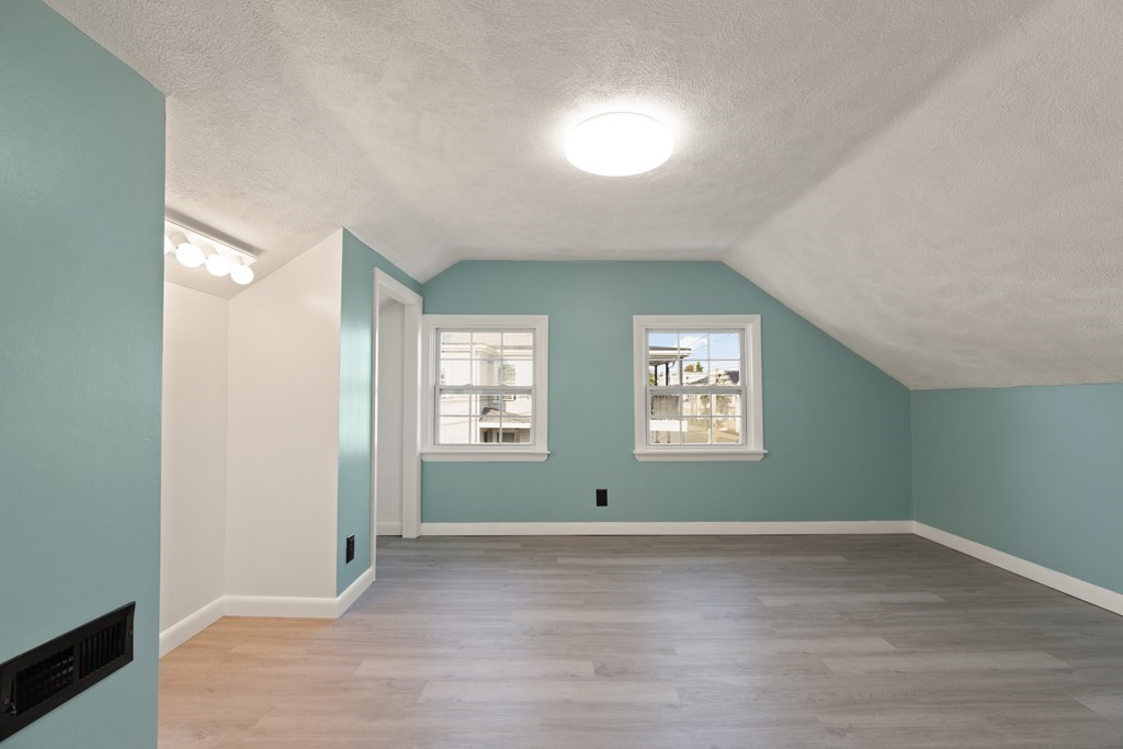 97 River Street Lynn, MA 01905 - Photo 24 of 30 a view of wooden floor and windows in a room
