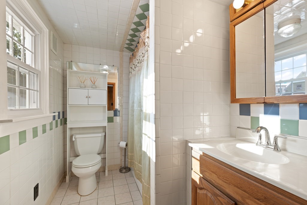 97 River Street Lynn, MA 01905 - Photo 27 of 30 a bathroom with a granite countertop sink toilet and shower