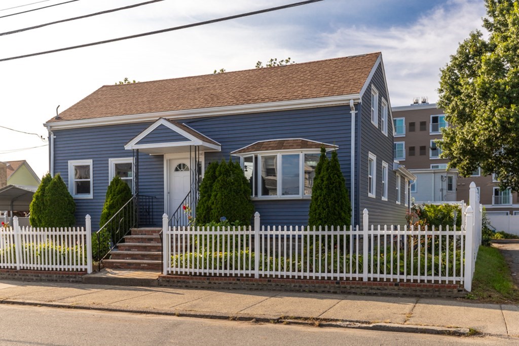 97 River Street Lynn, MA 01905 - Photo 3 of 30 a front view of a house with a garden