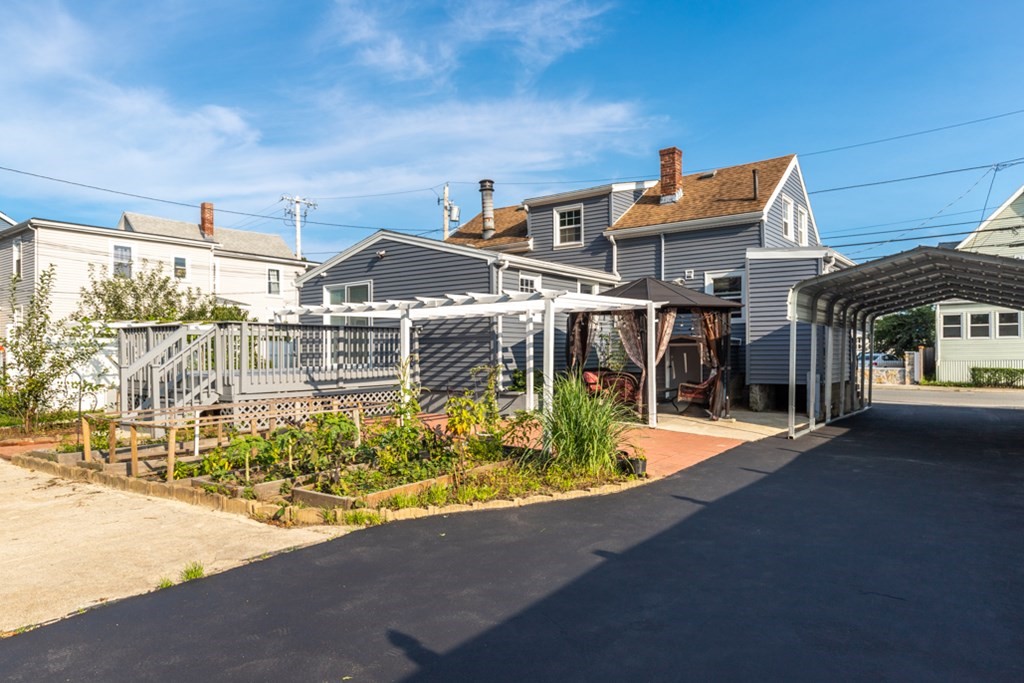 97 River Street Lynn, MA 01905 - Photo 5 of 30 a front view of a house with a yard