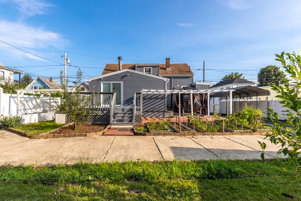 97 River Street Lynn, MA 01905 - Photo 6 of 30 a view of a house with yard and plants
