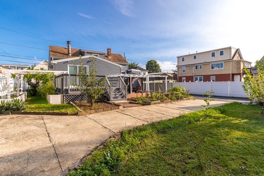 97 River Street Lynn, MA 01905 - Photo 7 of 30 a front view of a house with garden