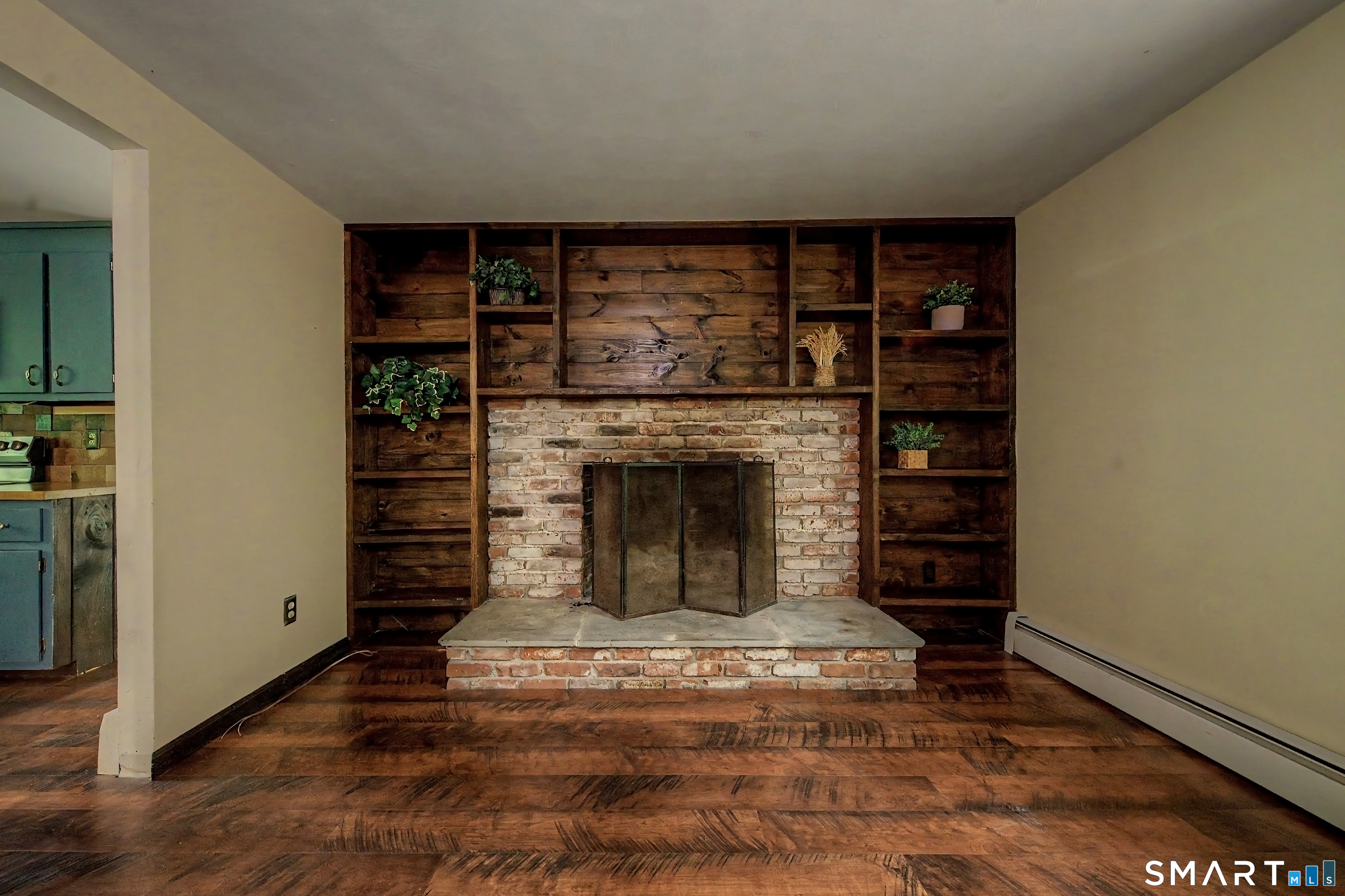 216 Reservoir Road Killingworth, CT 06419 - Photo 5 of 36 Wood burning fireplace is a main feature of the home.