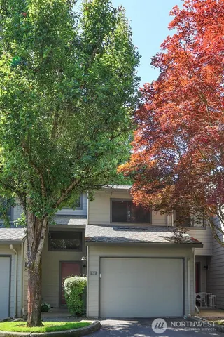a view of a house with a tree