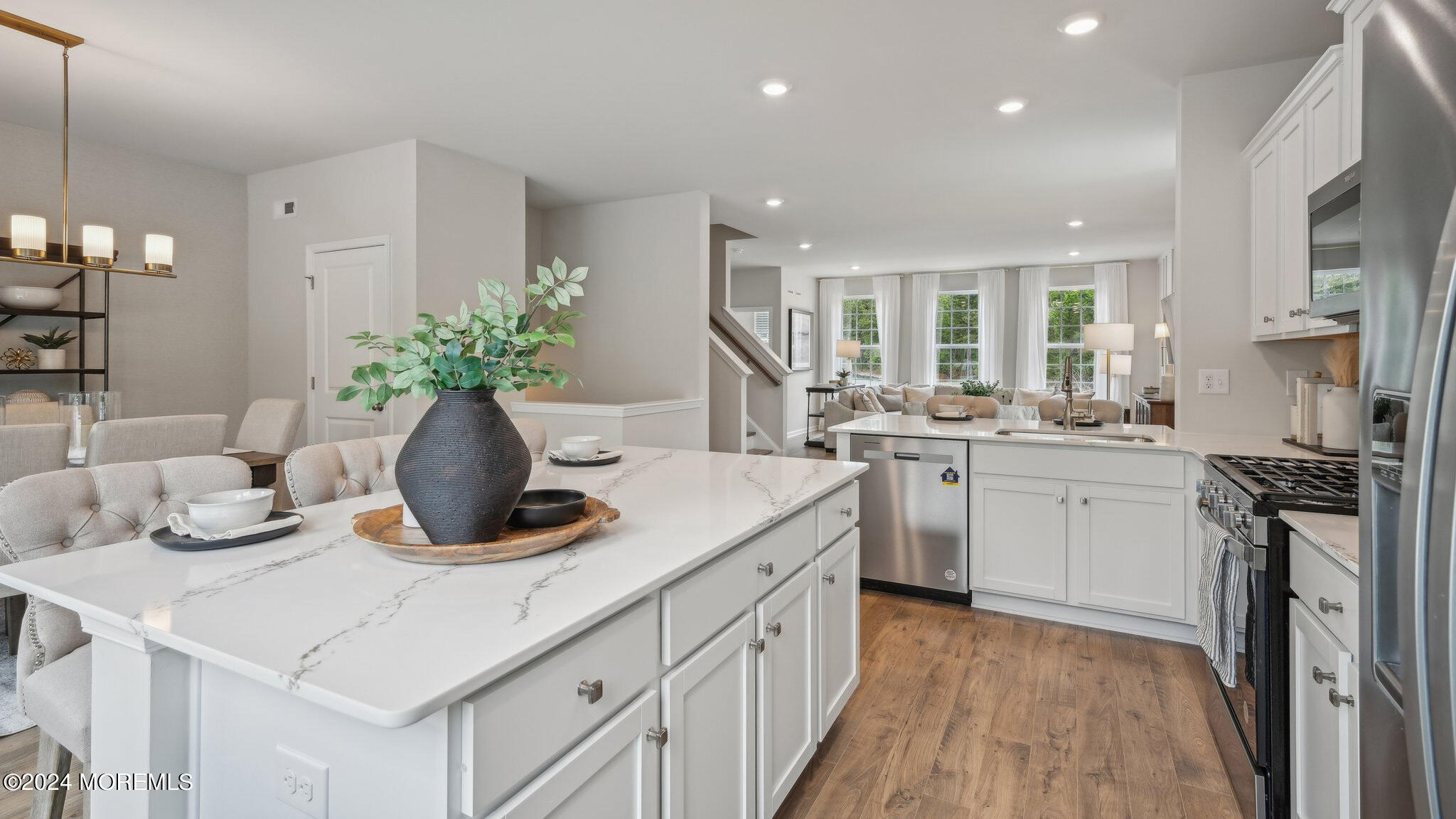 8 Rothbury Court Tinton Falls, NJ 07753 - Photo 20 of 43 a kitchen with a sink stove and cabinets