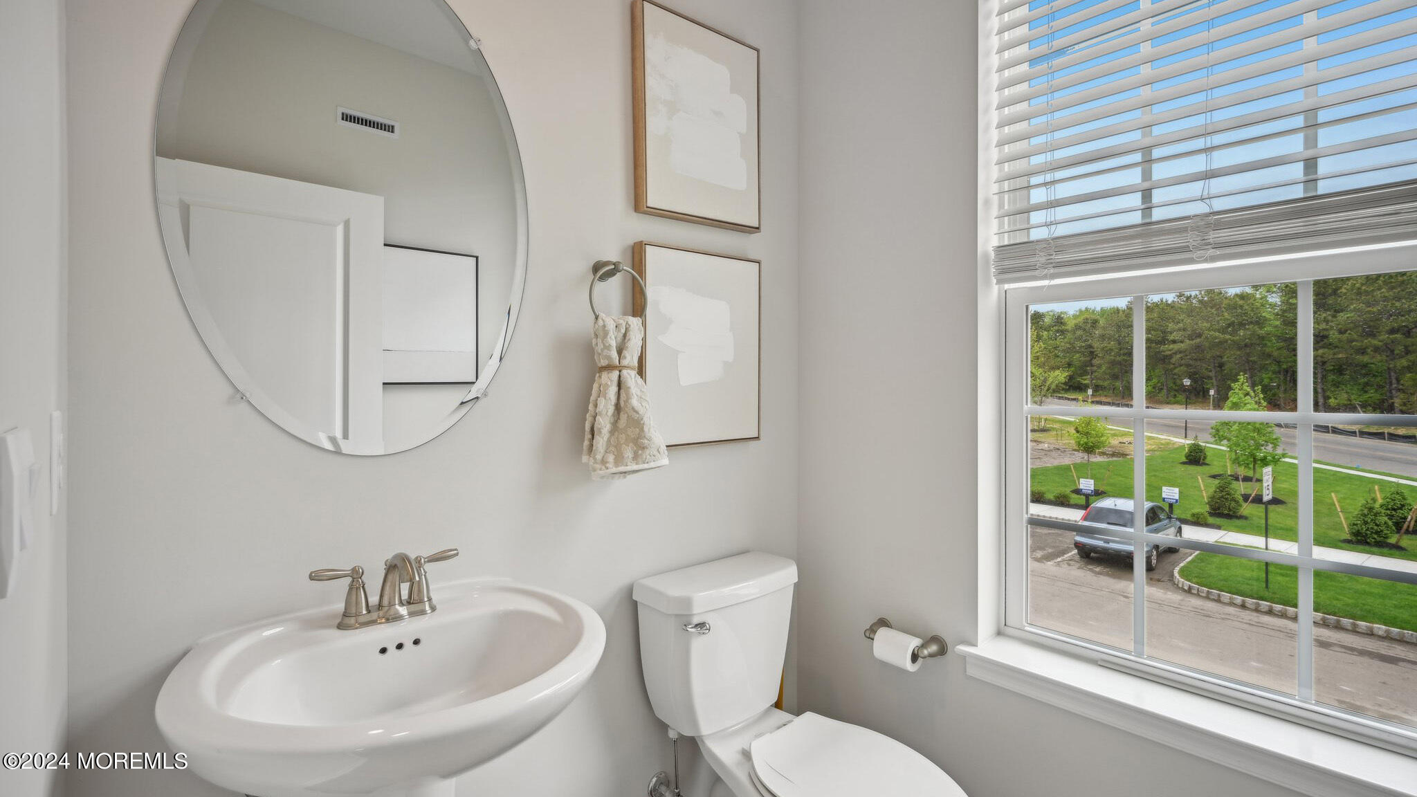 8 Rothbury Court Tinton Falls, NJ 07753 - Photo 21 of 43 a bathroom with a toilet a sink and a mirror
