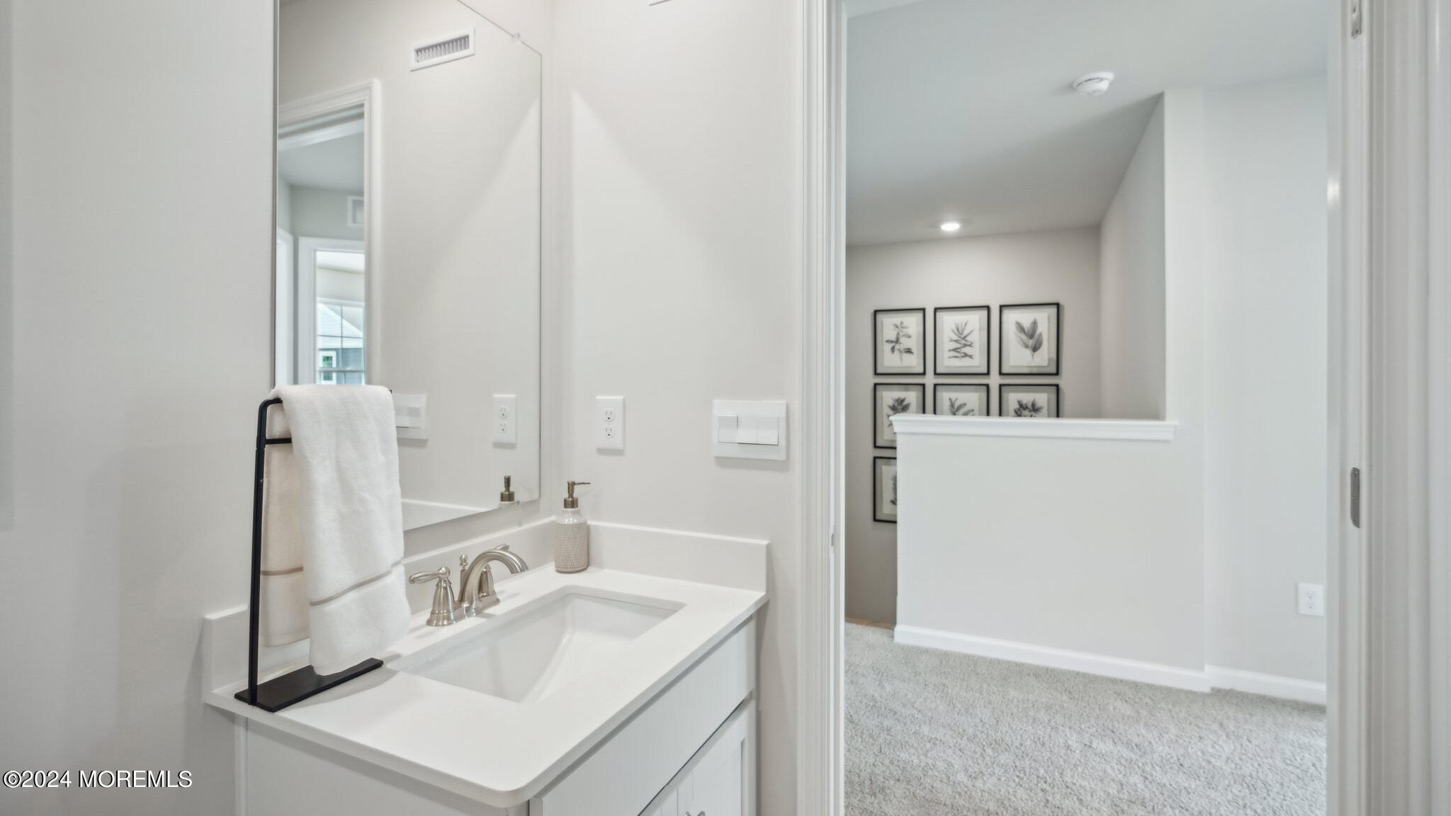 8 Rothbury Court Tinton Falls, NJ 07753 - Photo 29 of 43 a bathroom with a sink vanity and a mirror