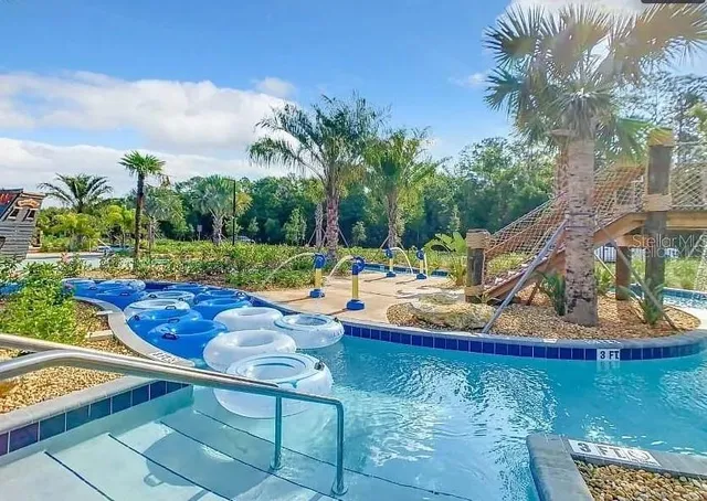 a room with pool table and wall paintings