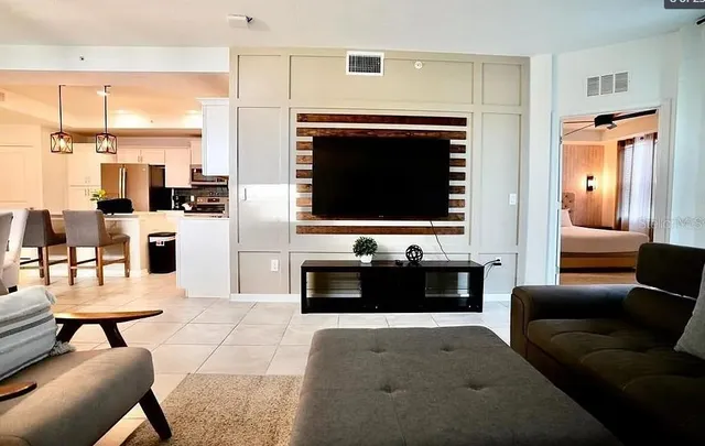 a kitchen with a refrigerator a microwave a stove and cabinets