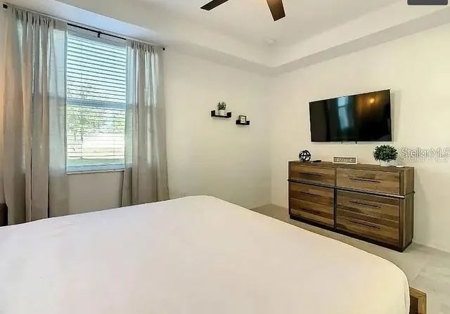 a view of a room with wooden floor