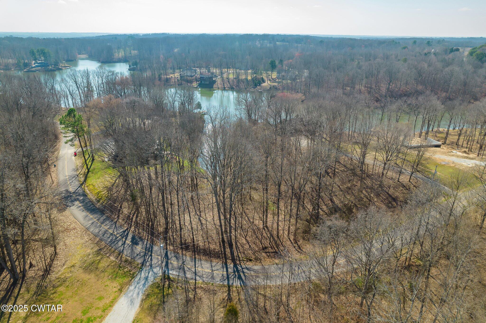 22 Lake Hayes Estates Road Trenton, TN 38382 - Photo 16 of 18 a view of a lake in middle of the house