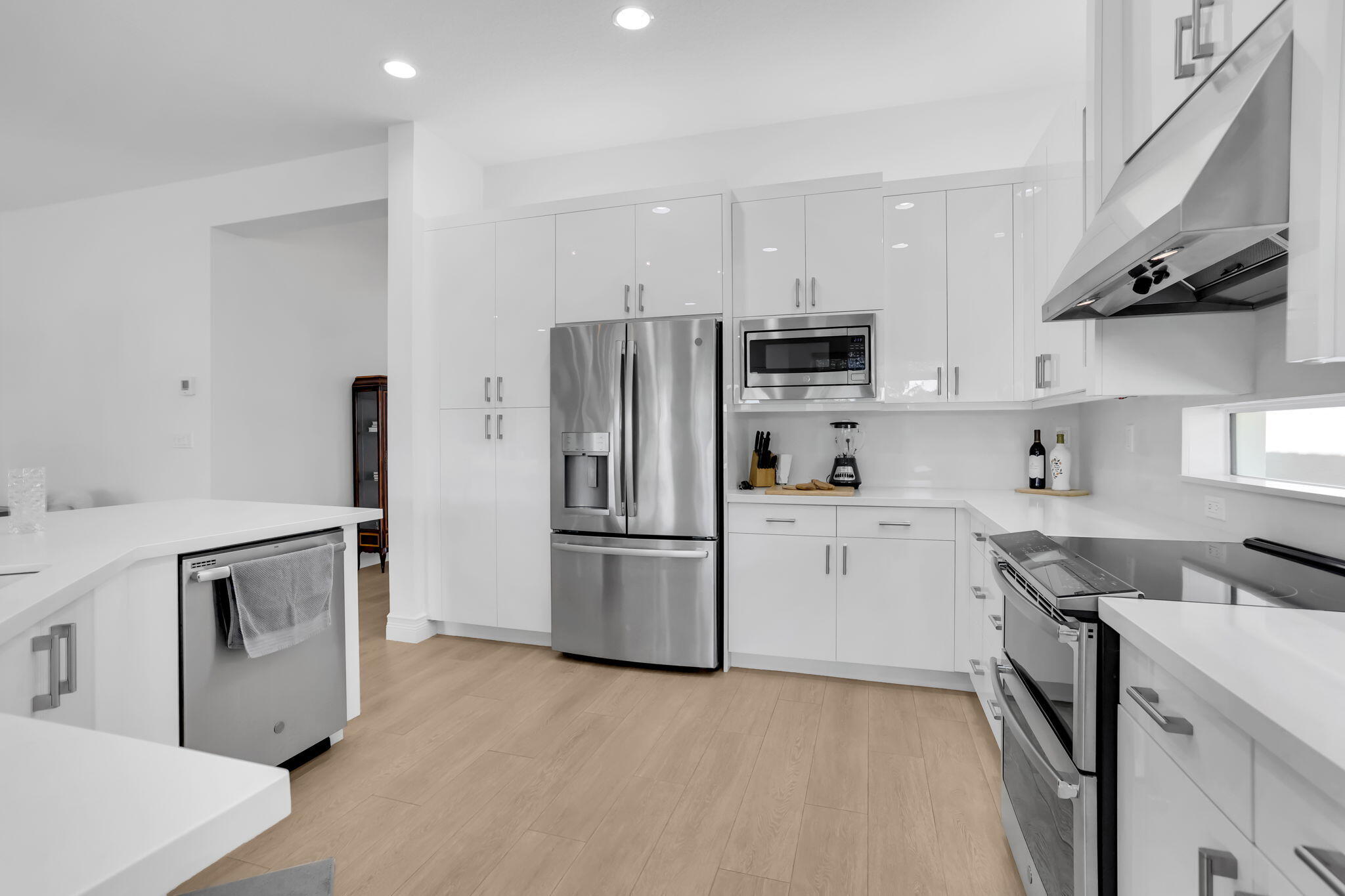 8254 Appalachian Ridge Road Boynton Beach, FL 33473 - Photo 12 of 50 a kitchen with a sink a stove and refrigerator